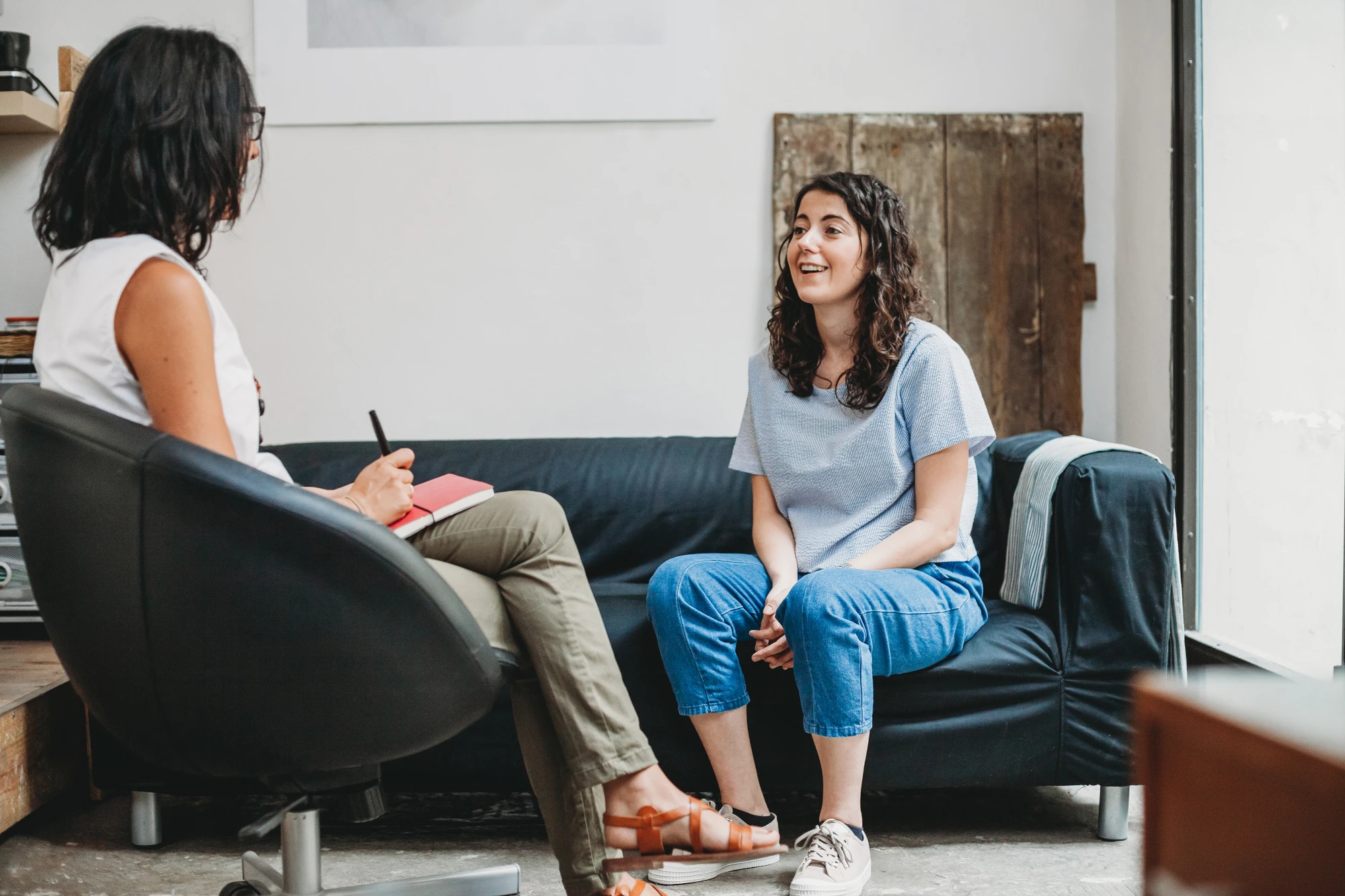 Woman talking with a therapist during an EMDR session for PTSD